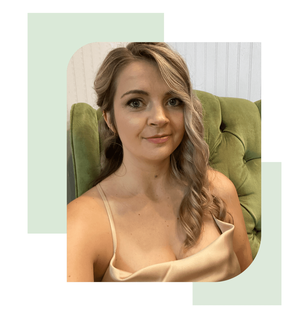 Lauren Deleon selfie on a green couch in a an blouse